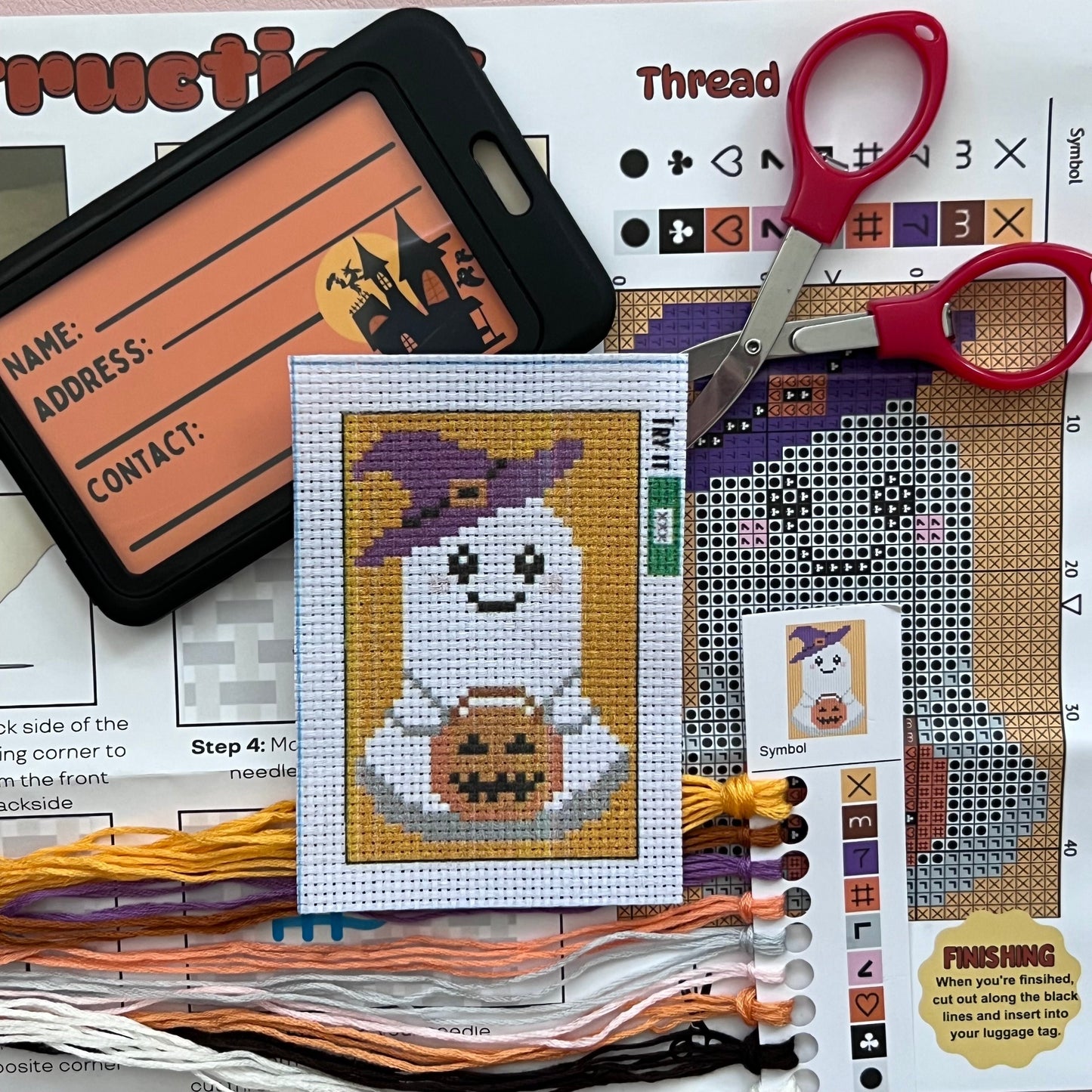 Ghost Cross stitch kit with luggage tag, instructions, and thread